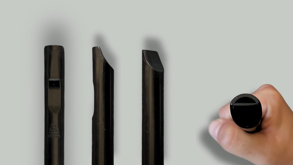 Close-ups of the Dixon DX005 tin whistle mouthpiece (head) and blowing windway