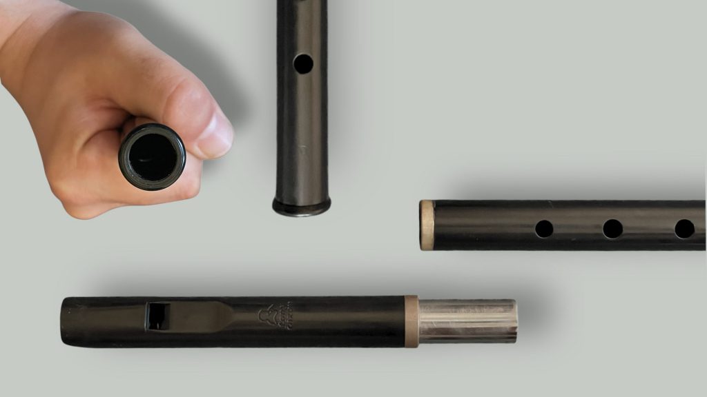 Close-up views of the Dixon DX005 tin whistle bottom end and tuning slide