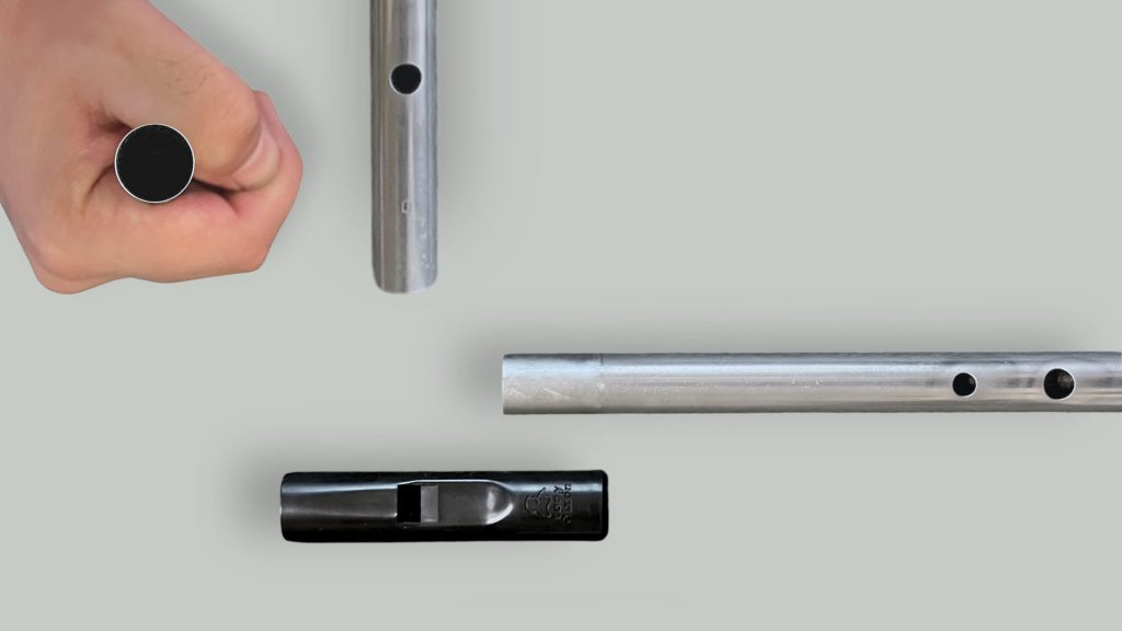 Close-up views of the Dixon Trad tin whistle bottom end and tuning slide