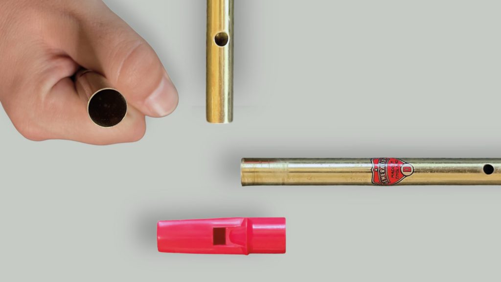Close-up views of the Generation tin whistle bottom end and tuning slide
