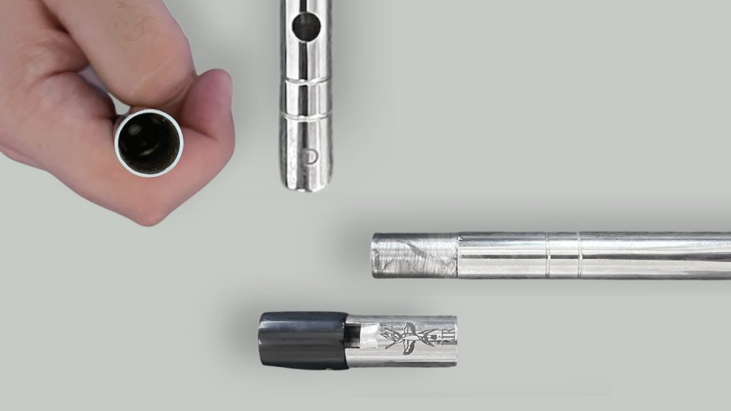 Close-up views of the Lir silver tin whistle bottom end and tuning slide